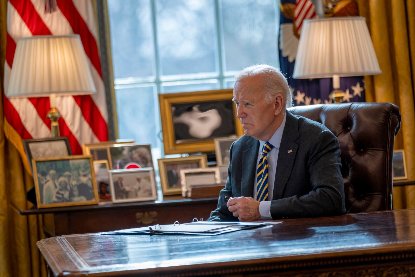 President Joe Biden listens during a briefing regarding the federal response to the spread of wildfires in the Los Angeles area, Friday, Jan. 10, 2025, in the Oval Office at the White House in Washington. (AP Photo/Ben Curtis)