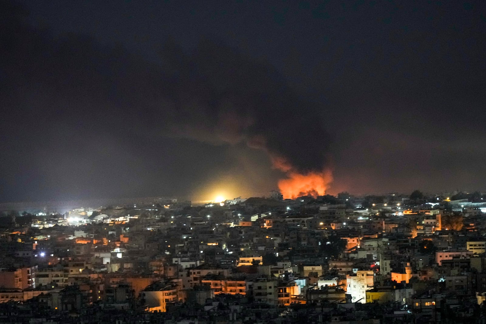 Flames and smoke rise from an Israeli airstrike on Dahiyeh in the southern suburb of Beirut, Tuesday, Oct. 22, 2024. (AP Photo/Bilal Hussein)