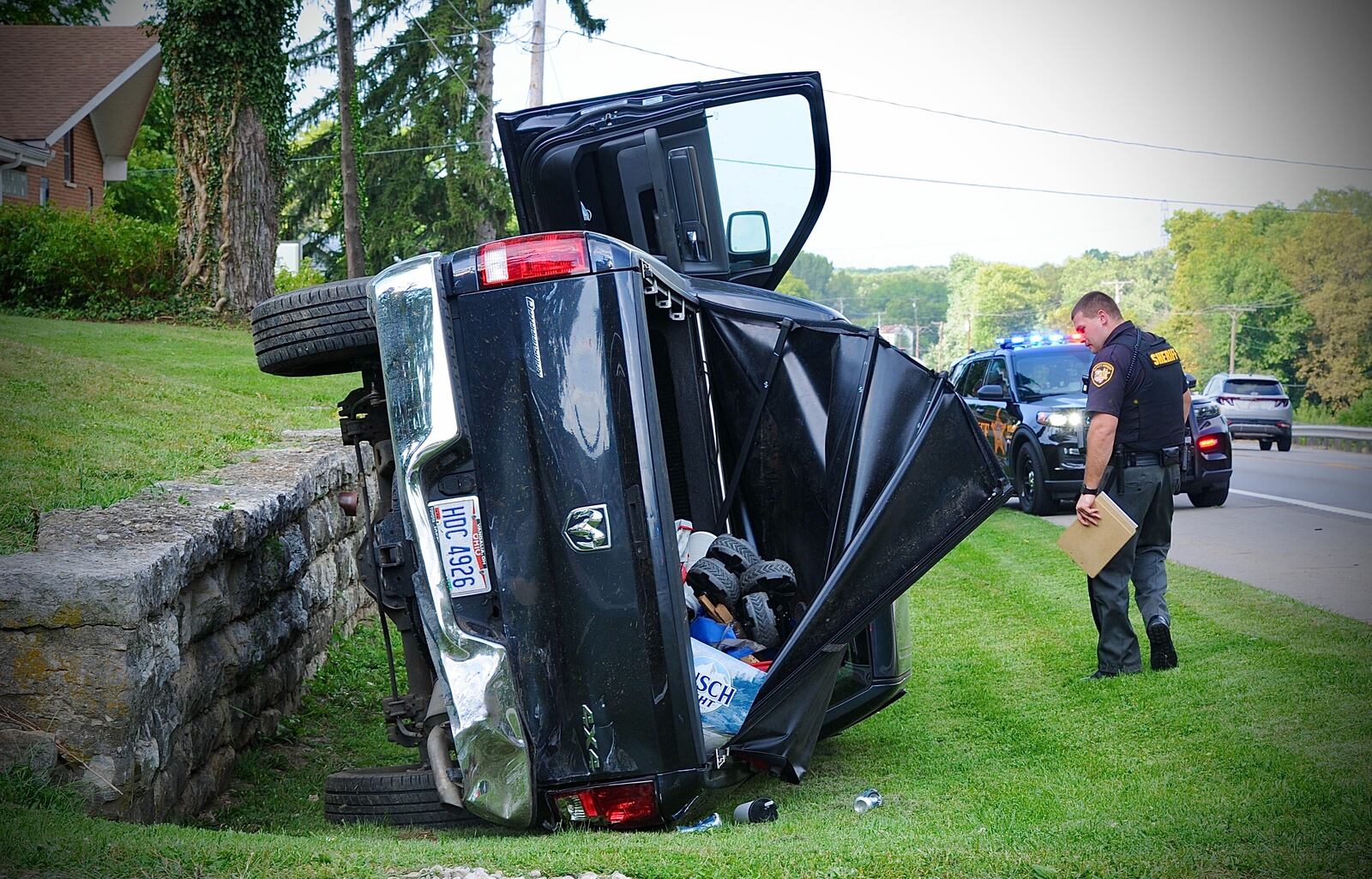 A hit-and-run driver who crashed into a pickup truck and another vehicle before the driver's SUV was pinned by two cruisers following a slow-speed pursuit in New Carlisle. MARSHALL GORBY/STAFF