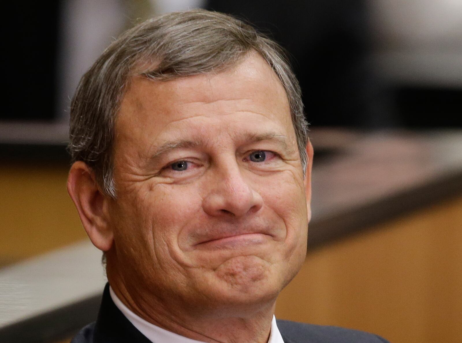 FILE - Supreme Court Chief Justice John Roberts smiles as he is introduced at the University of Nebraska Lincoln, in Lincoln, Neb., Sept. 19, 2014. (AP Photo/Nati Harnik, File)