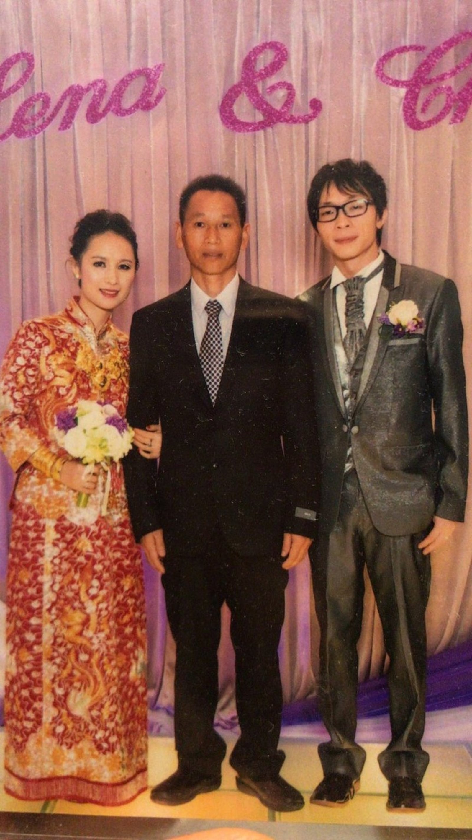 Lily Poynter’s older sister, Lena Wong, shown with their father, Huang Zhe Xue, center. Poynter, adopted from China as an infant, re-connected with her birth family in 2016.