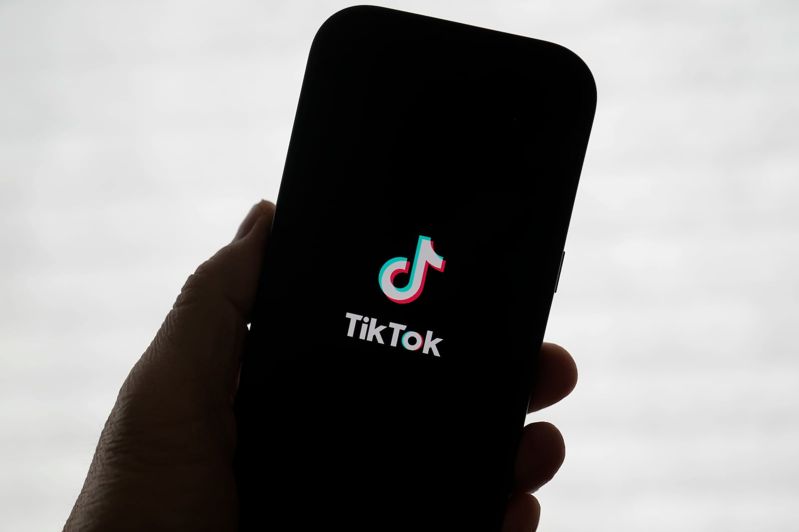 A TikTok logo is shown on a phone in San Francisco, Friday, Jan. 17, 2025. (AP Photo/Jeff Chiu)