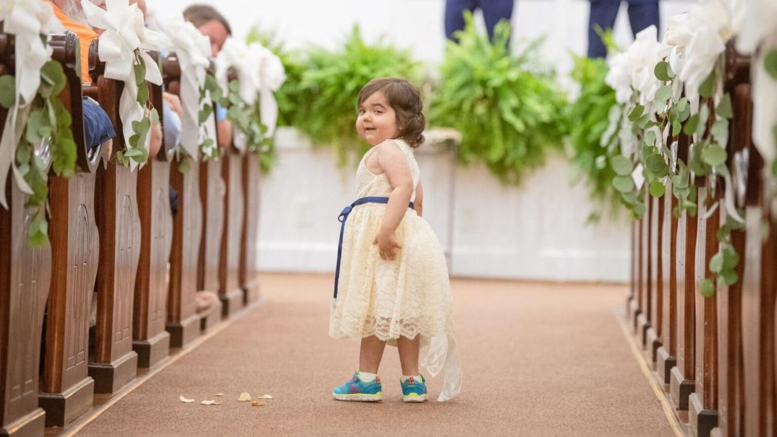 Skye Savren-McCormick, 3, proudly tossed flowers down the aisle for the bride, 26-year-old Hayden Hatfield Ryals.