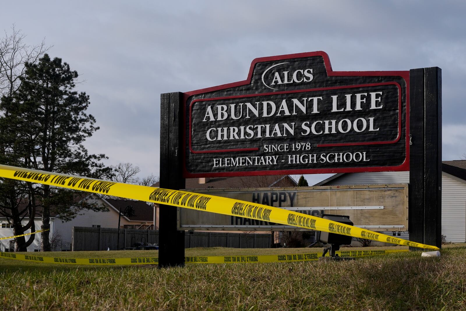 Police tape is seen outside the Abundant Life Christian School Tuesday, Dec. 17, 2024 in Madison, Wis., following a shooting on Monday. (AP Photo/Morry Gash)