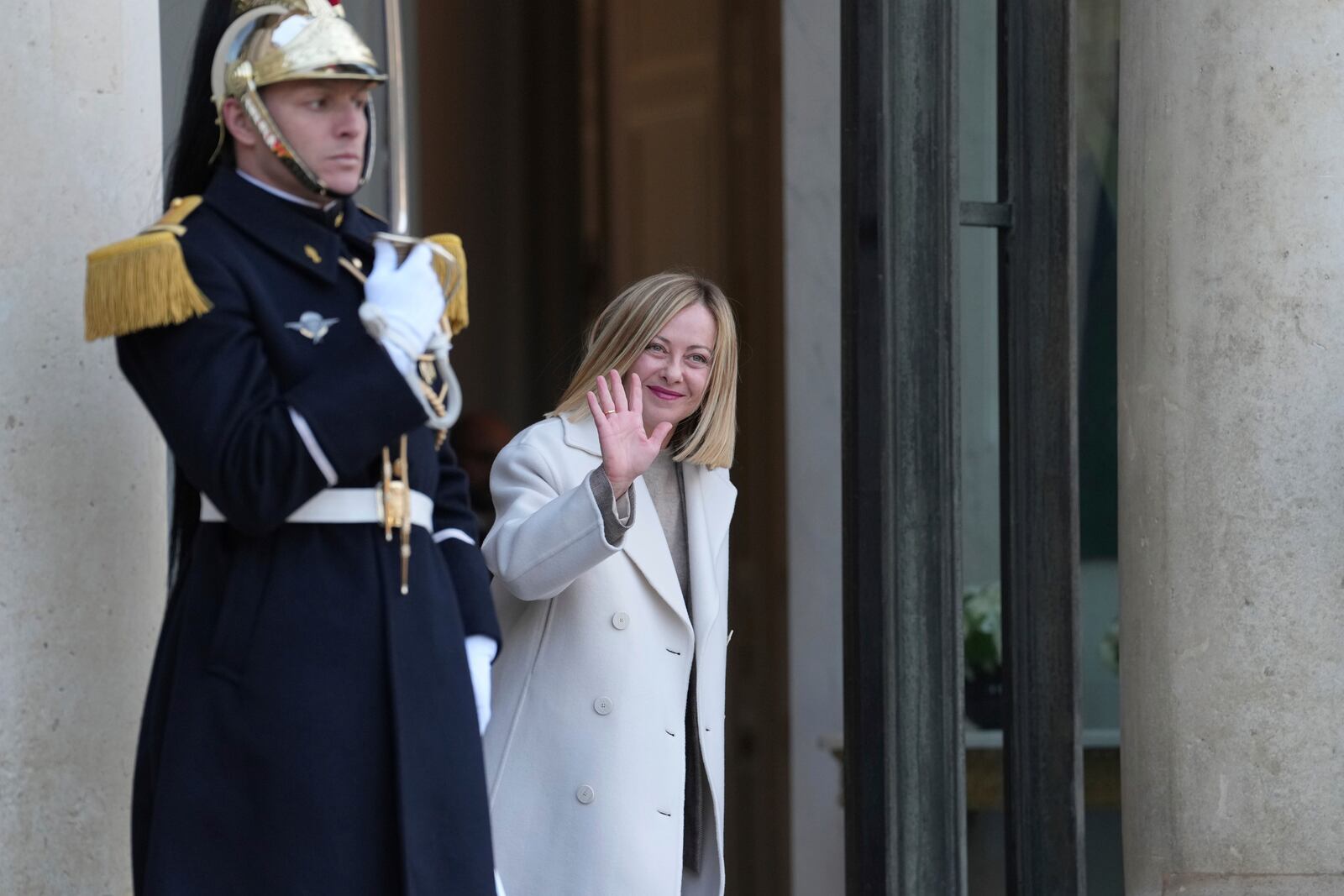 Italy's Prime Minister Giorgia Meloni waves as she arrives for an informal meeting of leaders from key European Union nations and the United Kingdom at the Elysee Palace in Paris, Monday, Feb. 17, 2025. (AP Photo/Aurelien Morissard)