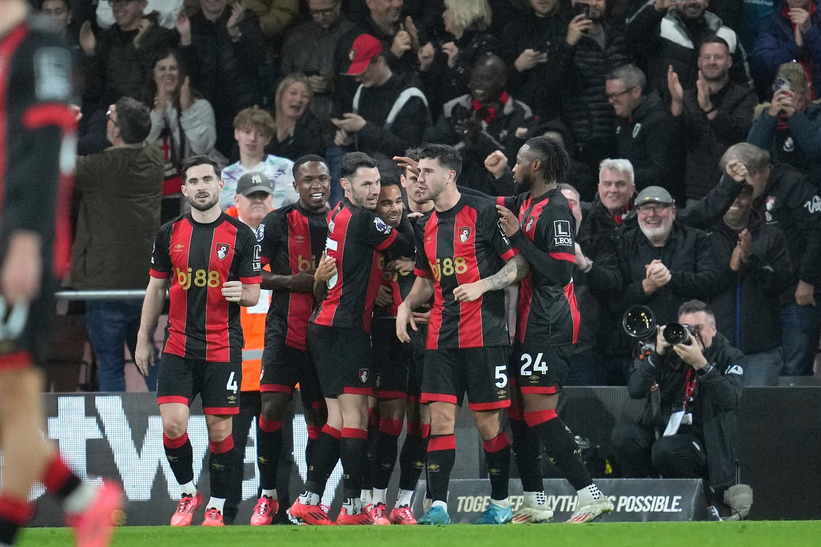 AFC Bournemouth players celebrate after Bournemouth's Justin Kluivert scored his side's second goal during the English Premier League soccer match between Bournemouth and Arsenal at the Vitality Stadium in Bournemouth, England, Saturday, Oct. 19, 2024. (AP Photo/Kin Cheung)