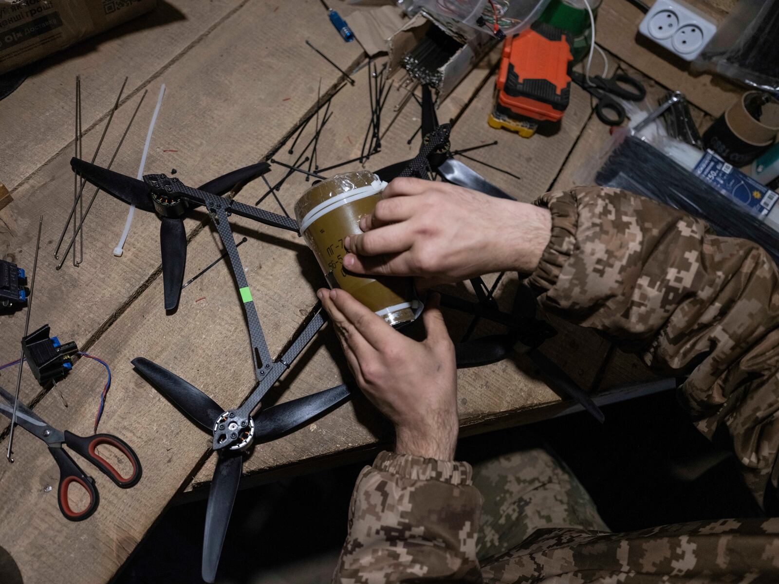 In this photo provided by Ukraine's 93rd Kholodnyi Yar Separate Mechanized Brigade press service, a soldier in a shelter gets ready to fire FPV drones towards Russian positions in a shelter in Kramatorsk direction, Donetsk region, Ukraine, Saturday, March 22, 2025. (Iryna Rybakova/Ukraine's 93rd Mechanized Brigade via AP)