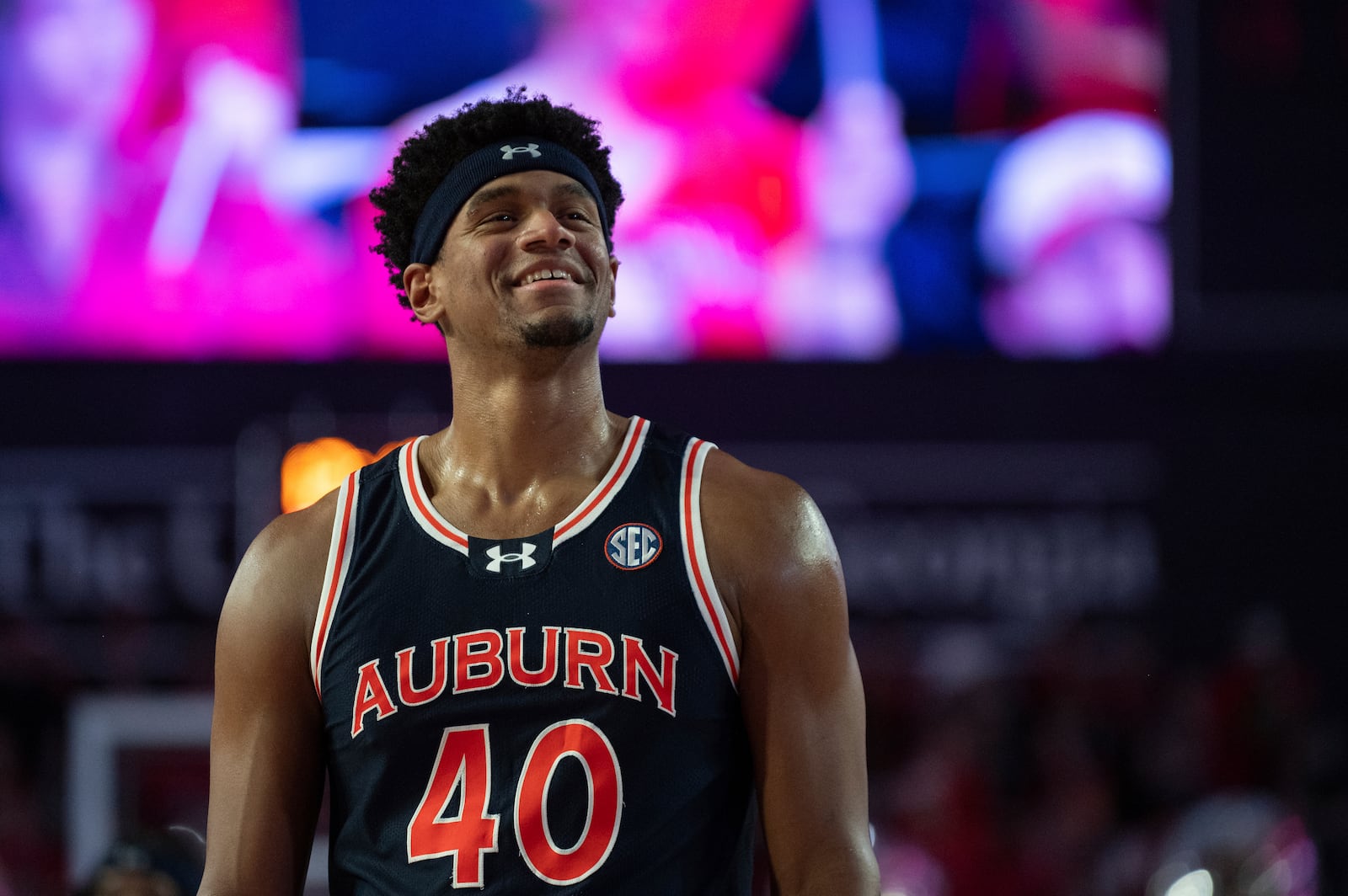 Auburn center Dylan Cardwell (40) smiles while walking down the court during the second half of an NCAA college basketball game against Georgia on Saturday, Jan. 18, 2025, in Athens, Ga. (AP Photo/Kathryn Skeean)