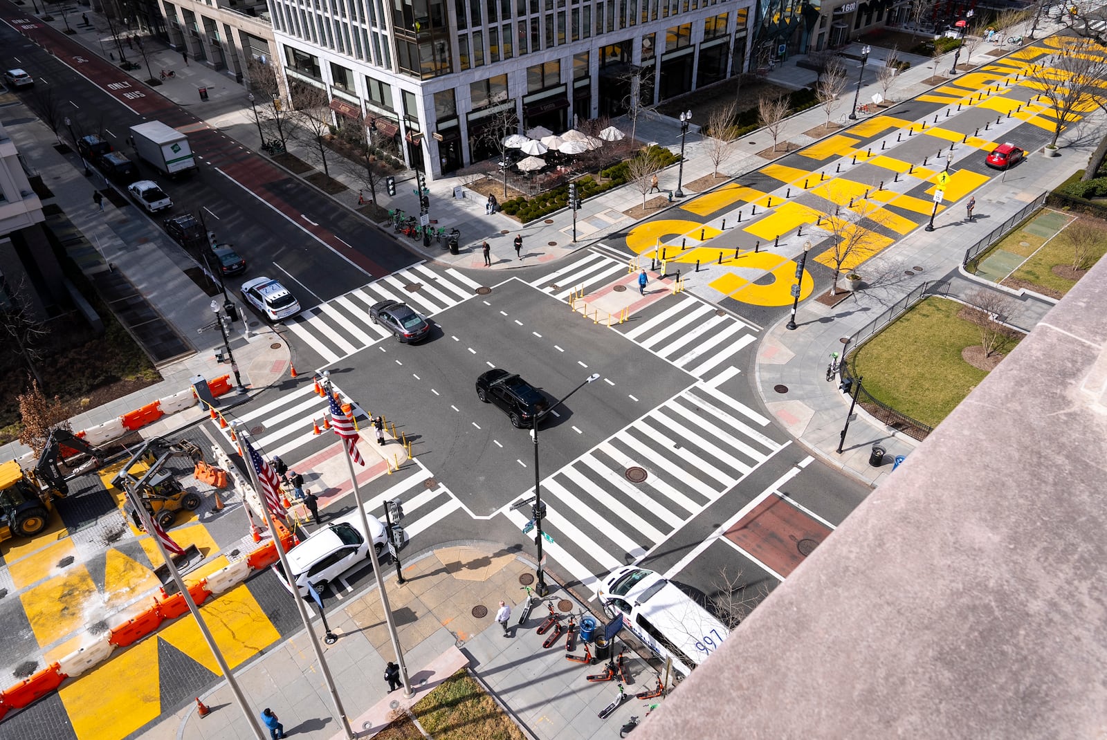 From the top of a building, the Black Lives Matter mural is seen as demolition begins at left, Monday, March 10, 2025, in Washington. (AP Photo/Jacquelyn Martin)