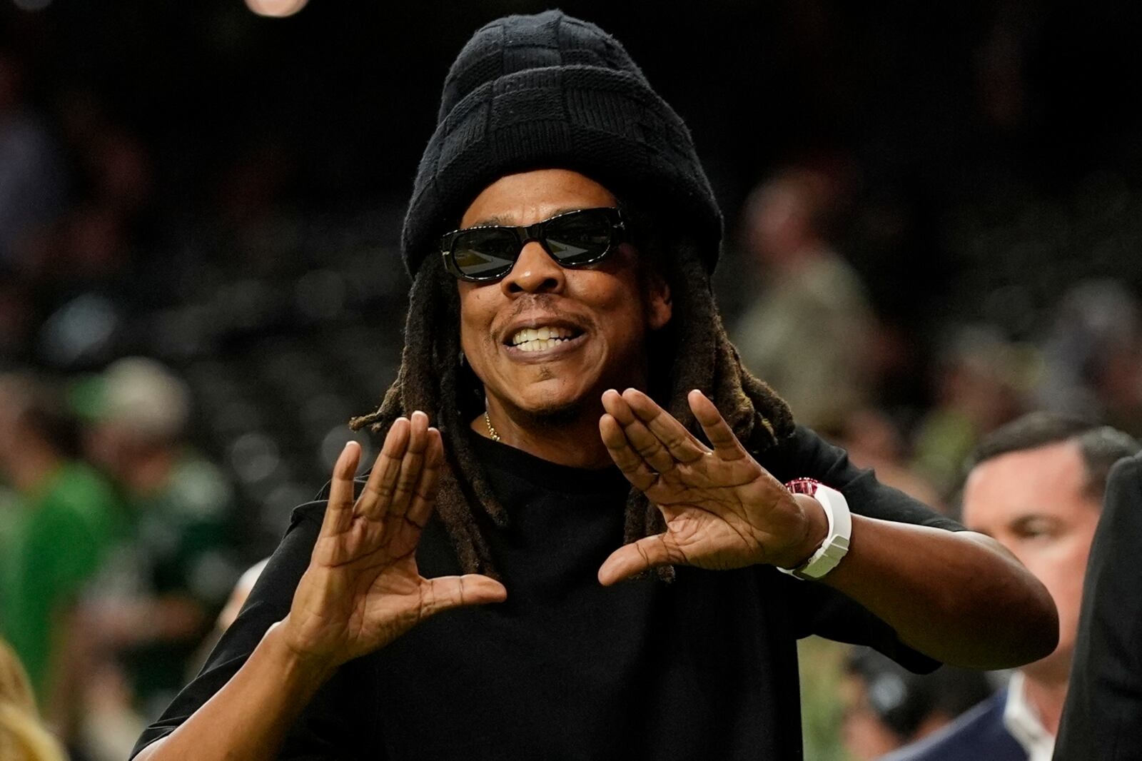 Jay-Z gestures from the sidelines prior to the NFL Super Bowl 59 football game between the Philadelphia Eagles and the Kansas City Chiefs, Sunday, Feb. 9, 2025, in New Orleans. (AP Photo/Frank Franklin II)