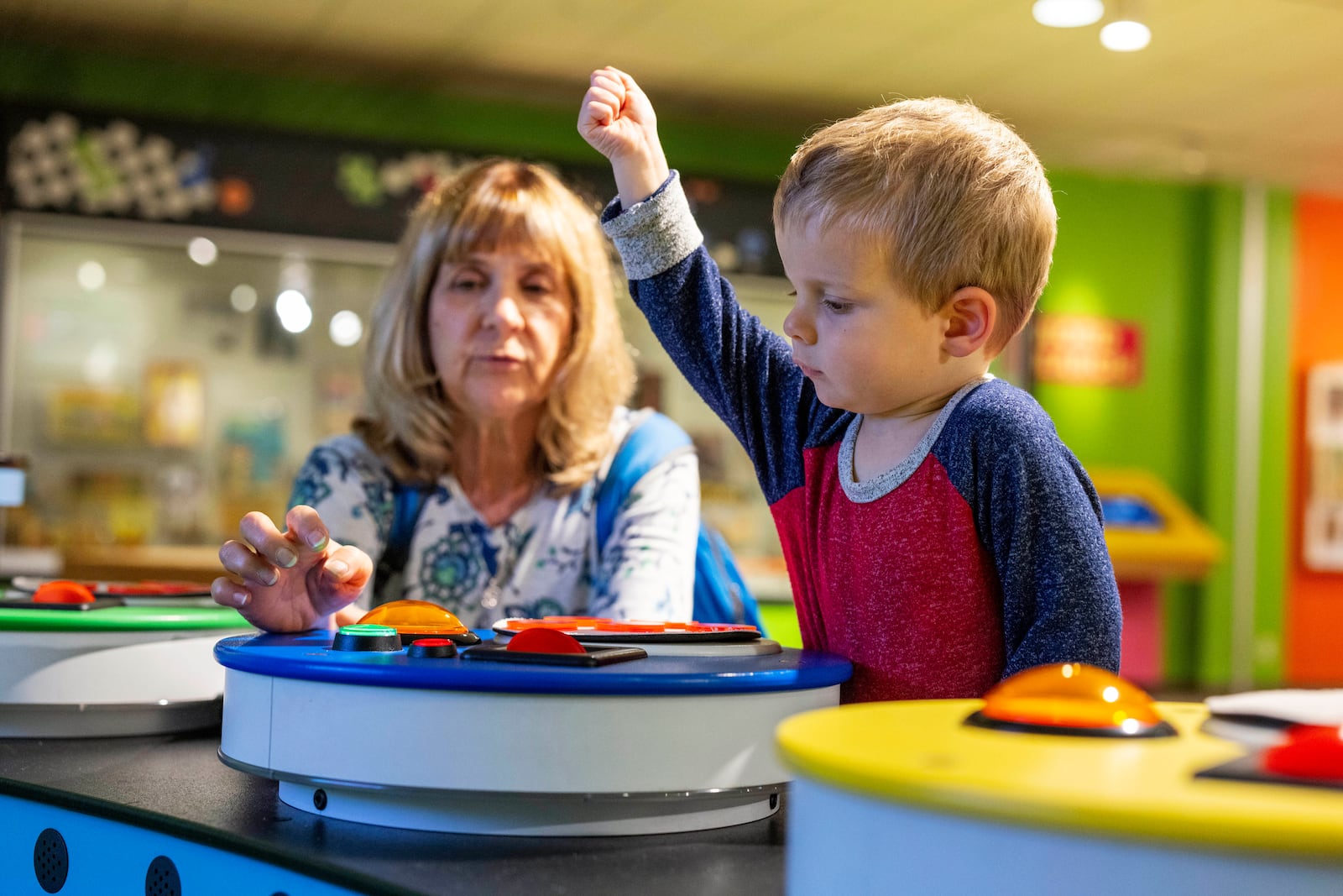 Rita Wilks plays a game of Bingo with her grandson, Oliver, 2, while visiting The Strong National Museum of Play, Tuesday, Oct. 15, 2024, in Rochester, N.Y. (AP Photo/Lauren Petracca)