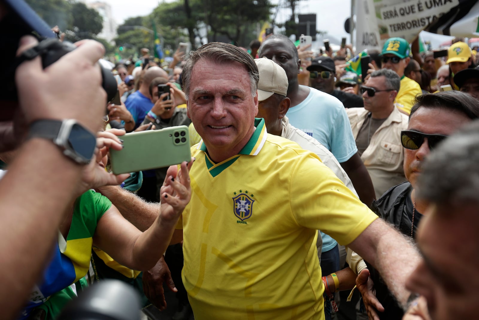 Brazil's former President Jair Bolsonaro arrives at a rally on Copacabana Beach in support of a proposed bill to grant amnesty to those arrested for storming government buildings in an alleged coup attempt in 2023, in Rio de Janeiro, Sunday, March 16, 2025. (AP Photo/Bruna Prado)