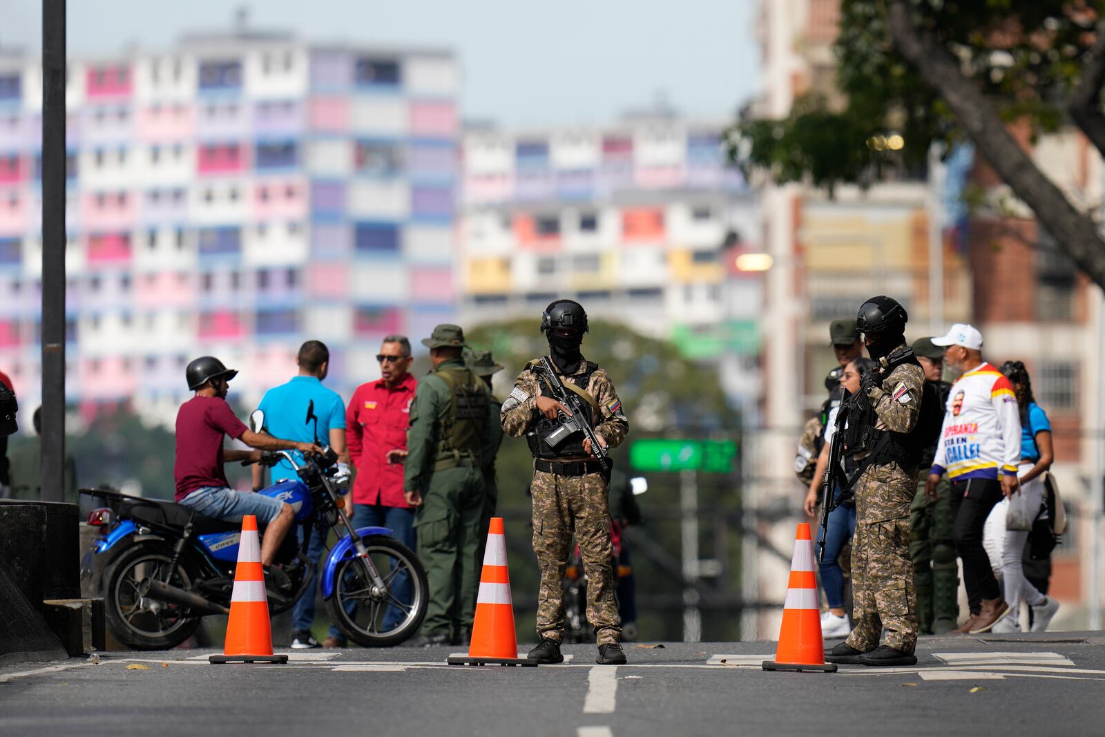 Security forces stand guard ahead of President Nicolas Maduro's swearing-in for a third term, in Caracas, Venezuela, Sunday, Jan. 5, 2025. (AP Photo/Matias Delacroix)