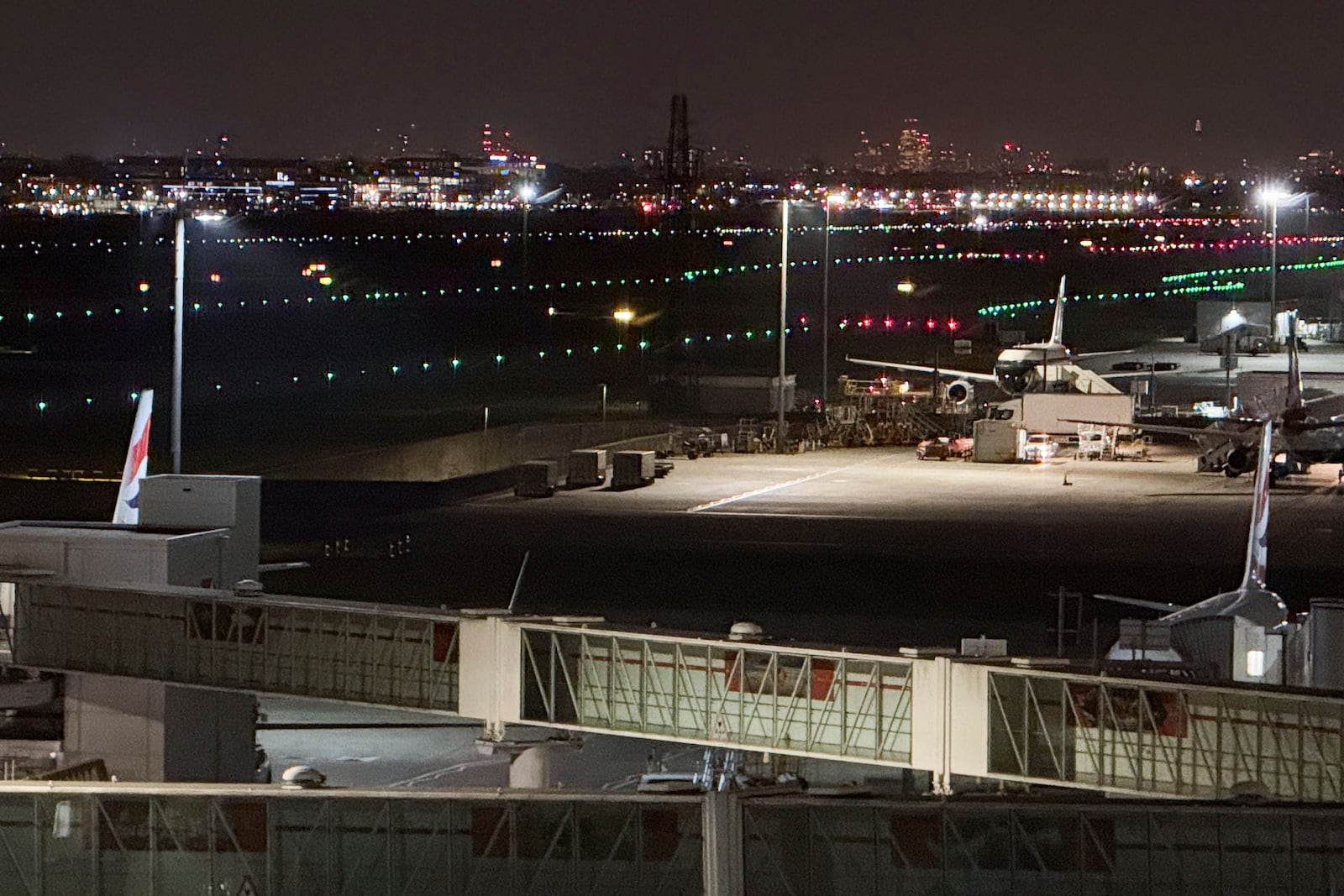 The runway at Heathrow Airport is lit again after a fire at an electrical substation shuttered Europe's busiest air travel hub in London, Friday, March 21, 2025.(AP Photo/Alberto Pezzali)