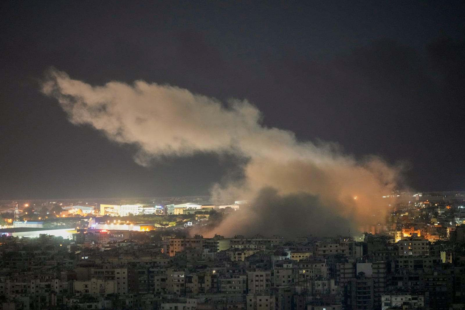 Smoke rises from an Israeli airstrike on Dahiyeh, in the southern suburb of Beirut, Tuesday, Oct. 22, 2024. (AP Photo/Bilal Hussein)