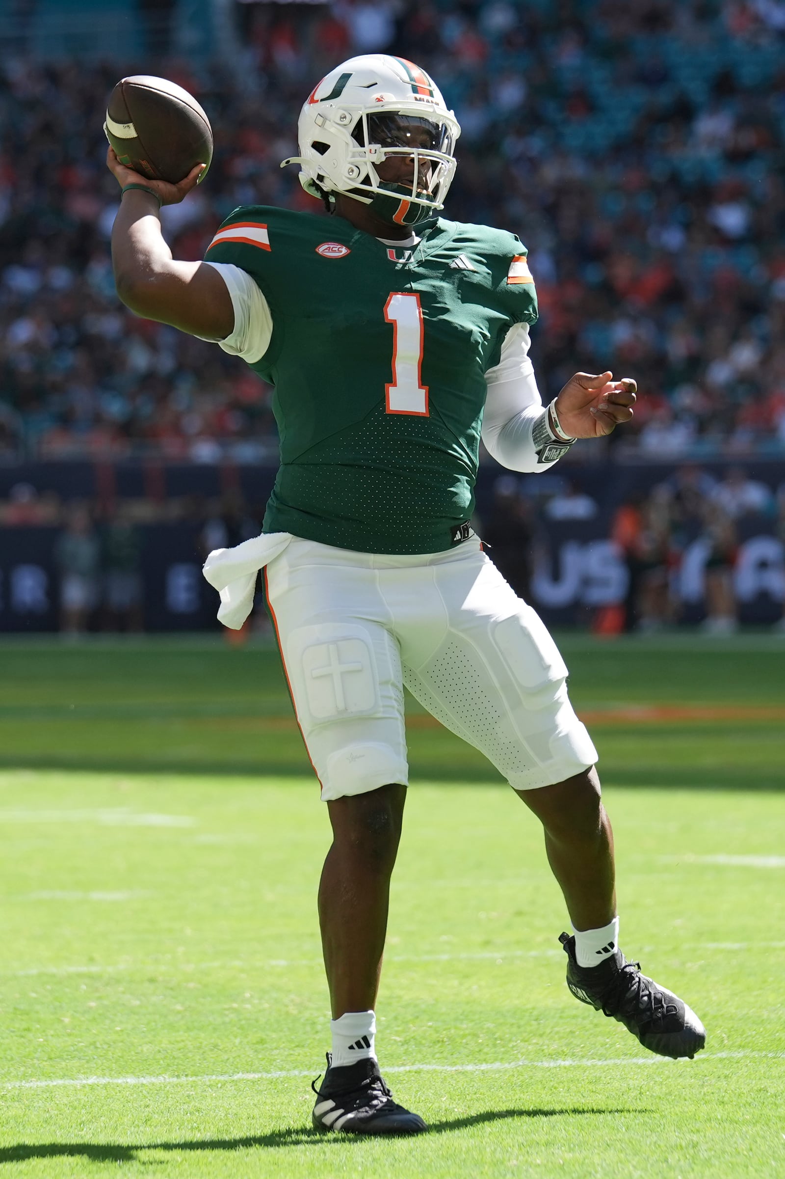 Miami quarterback Cam Ward (1) looks to pass during the first half of an NCAA college football game against Wake Forest, Saturday, Nov. 23, 2024, in Miami Gardens, Fla. (AP Photo/Lynne Sladky)