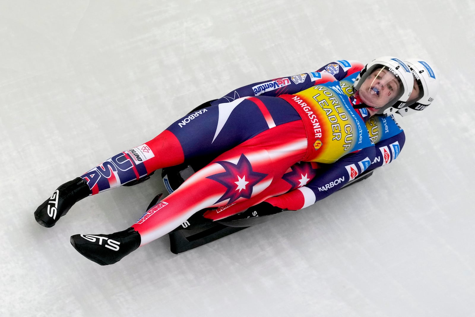 Chevonne Chelsea Forgan and Sophia Kirkby of the United States compete during the women's sprint race at the Luge World Cup in Igls near Innsbruck, Austria, Saturday, Dec. 7, 2024. (AP Photo/Matthias Schrader)