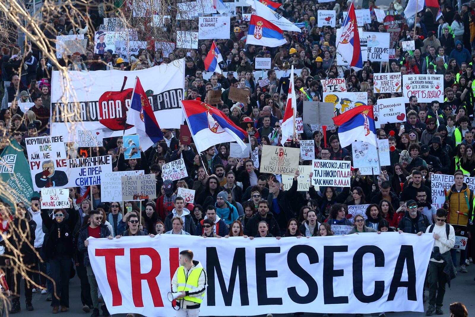 People march during a protest over the collapse of a concrete canopy that killed 15 people more than two months ago, in Novi Sad, Serbia, Saturday, Feb. 1, 2025. The front banner reads: "Three months". (AP Photo/Armin Durgut)