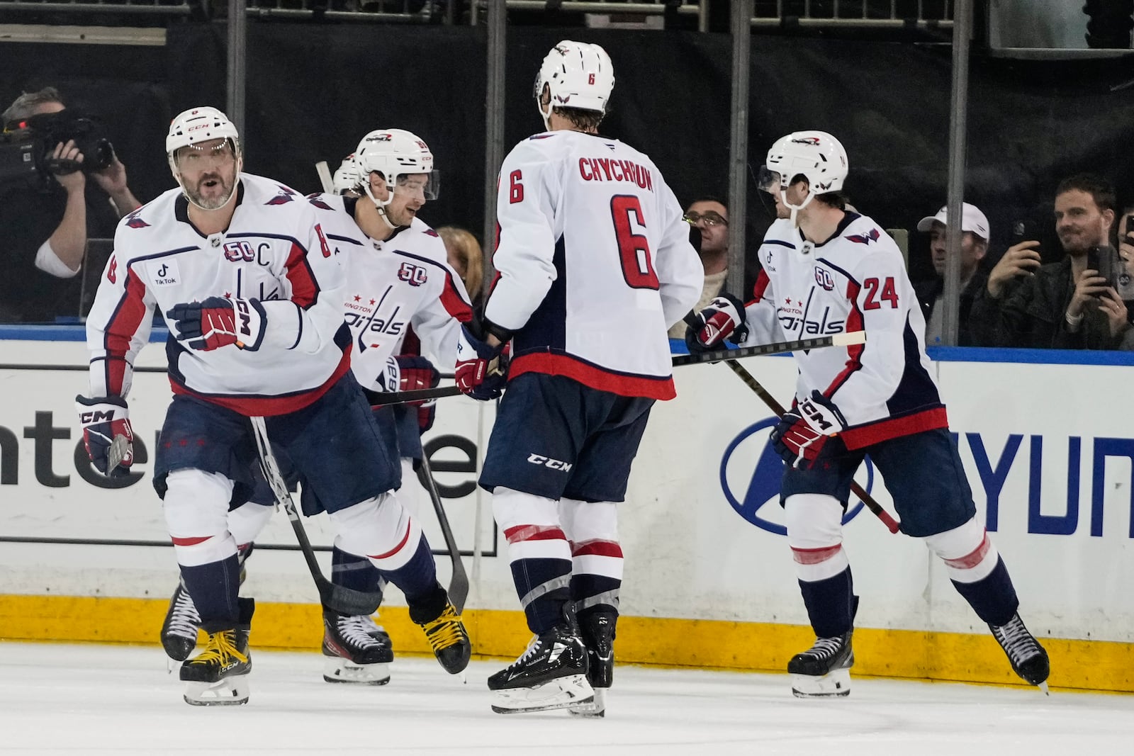 Washington Capitals' Alex Ovechkin, left, celebrates with teammates after scoring a goal during the third period of an NHL hockey game against the New York Rangers Wednesday, March 5, 2025, in New York. (AP Photo/Frank Franklin II)