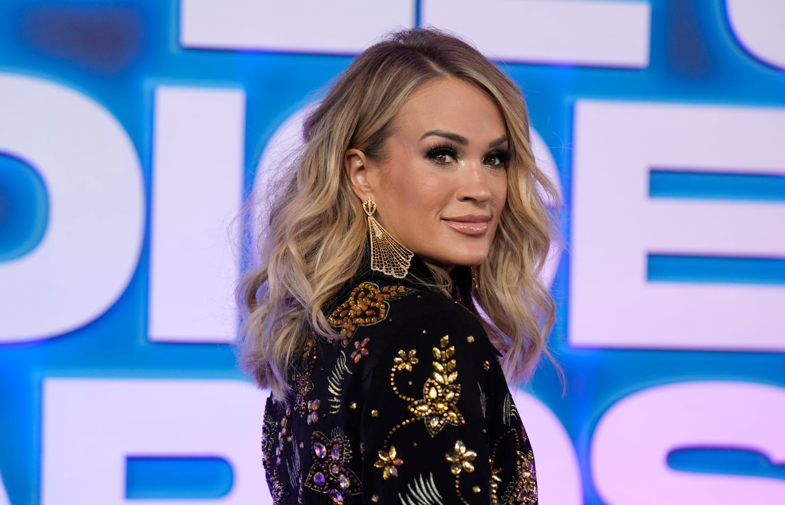 FILE - Carrie Underwood arrives at the People's Choice Awards, Dec. 6, 2022, in Santa Monica, Calif. (AP Photo/Chris Pizzello, File)