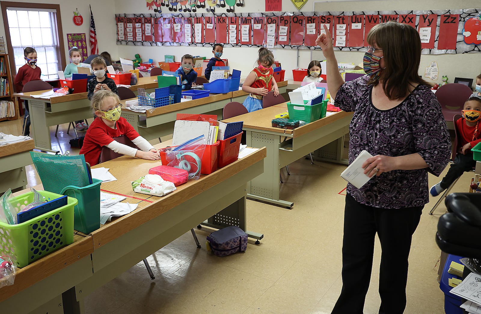 Cheri Mayfield, a kindergarten teacher from Reid School, teaches her class from The Village for the first time Monday. Students and teachers from Reid School in the Clark Shawnee School District had to be relocated to other buildings in the district after Reid became unsafe. BILL LACKEY/STAFF