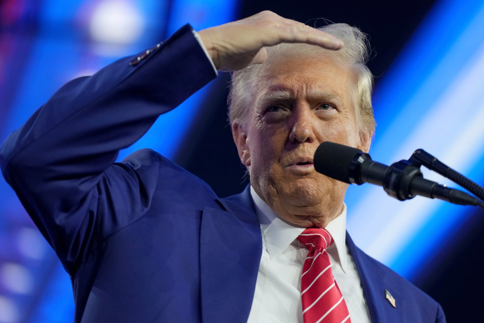 President-elect Donald Trump speaks at AmericaFest, Sunday, Dec. 22, 2024, in Phoenix. (AP Photo/Rick Scuteri)