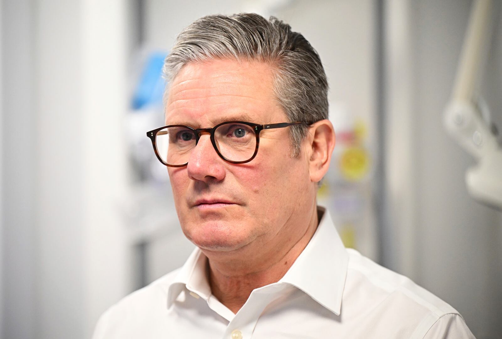 Britain's Prime Minister Keir Starmer visits a healthcare provider to deliver remarks on reducing NHS wait times, in Surrey, England, Monday, Jan. 6, 2025, (Leon Neal/Pool Photo via AP)