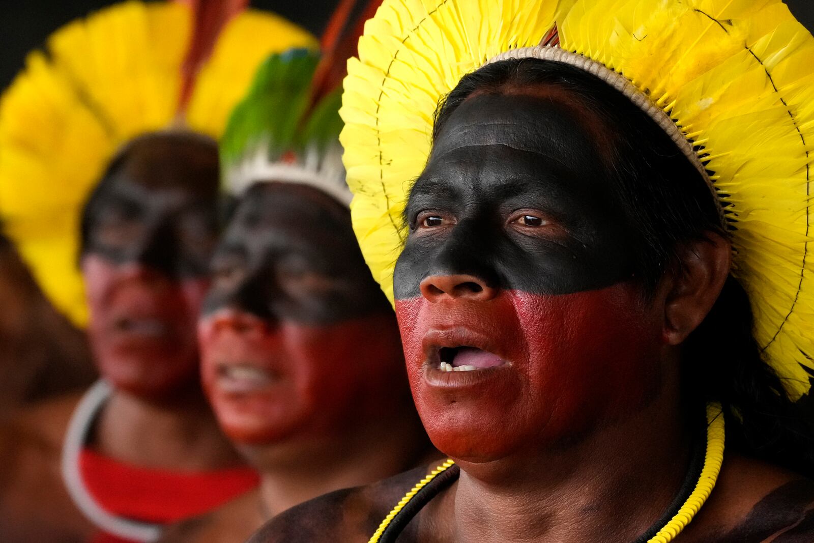 Kayapos sing during a protest against the prospective creation of a benchmark time limit that threatens to strip some Indigenous lands, in Brasilia, Brazil, Wednesday, Oct. 30, 2024. (AP Photo/Eraldo Peres)