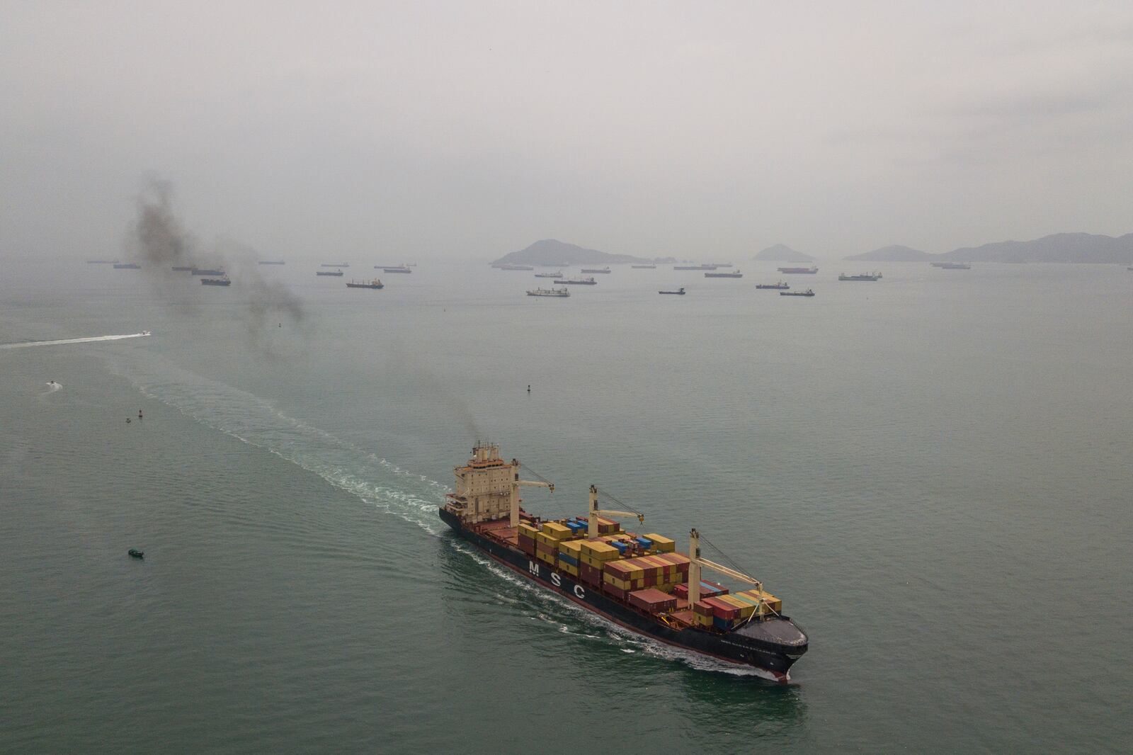 A cargo ship sails towards the Pacific Ocean waiting to transit the Panama Canal in Panama City, Saturday, Feb. 1, 2025. (AP Photo/Matias Delacroix)