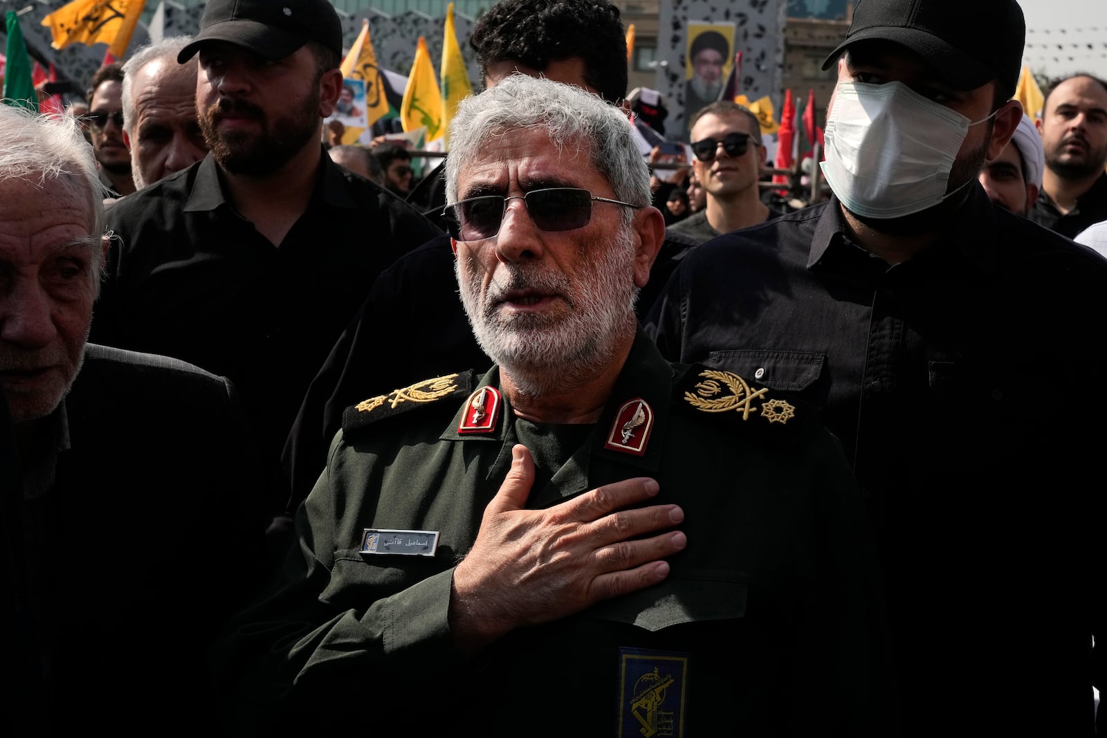 Commander of the Iran's Revolutionary Guard Quds Force, Gen. Esmail Qaani, mourns during the funeral ceremony of the late Revolutionary Guard Gen. Abbas Nilforushan, who was killed in an Israeli airstrike in Beirut in late September, in Tehran, Iran, Tuesday, Oct. 15, 2024. (AP Photo/Vahid Salemi)