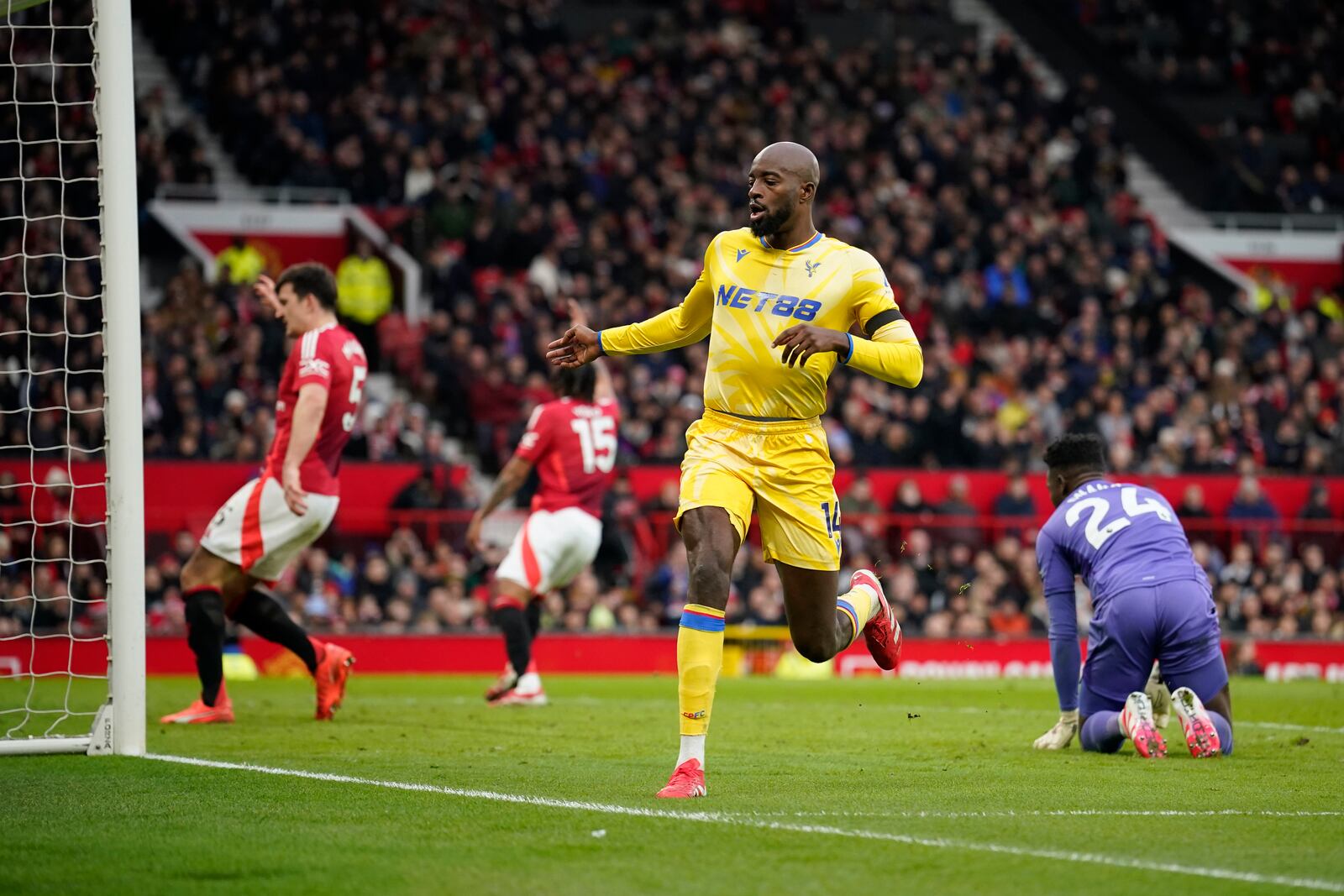 Crystal Palace's Jean-Philippe Mateta celebrates after scoring his side's second goal during the English Premier League soccer match between Manchester United and Crystal Palace at Old Trafford stadium in Manchester, England, Sunday, Feb. 2, 2025. (AP Photo/Dave Thompson)