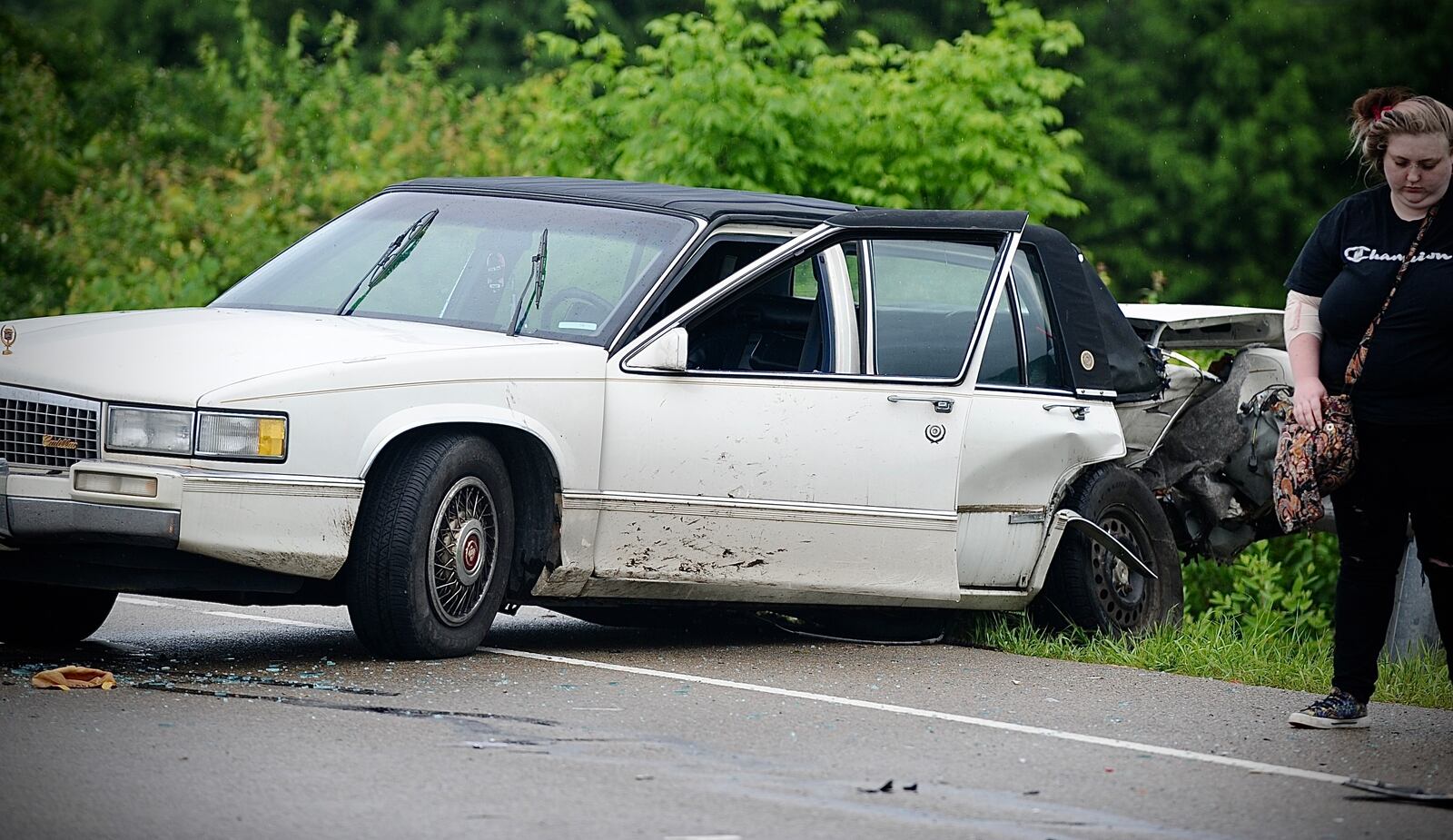 Crews work at a multi-vehicle accident near the intersection of Dayton-Springfield Road and S. Tecumseh Road near Interstate 70 on Tuesday, May 14, 2024. MARSHALL GORBY \STAFF