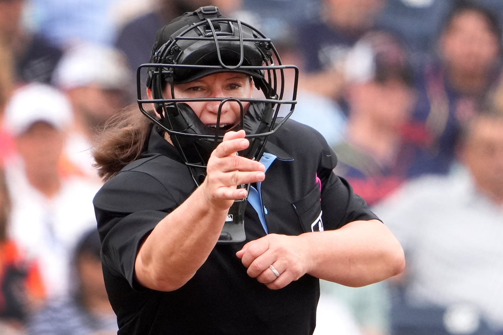 FILE - Home plate umpire Jen Pawol calls a strike during the third inning of a spring training baseball game between the Miami Marlins and Houston Astros Sunday, March 10, 2024, in West Palm Beach, Fla. (AP Photo/Jeff Roberson, File)