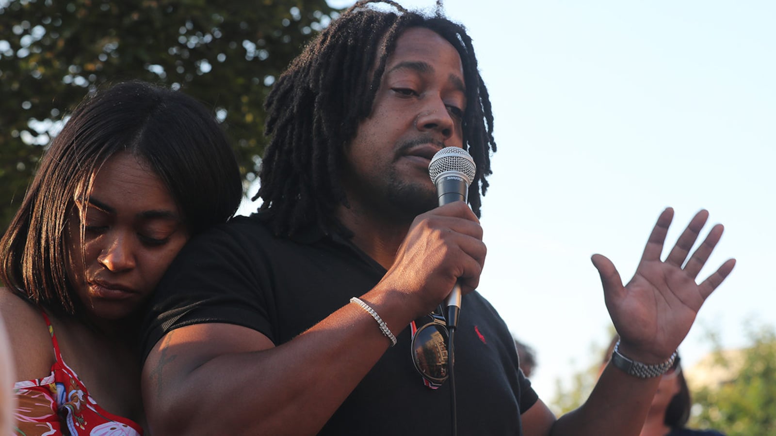 Dion Green, the son of Derrick Fudge, who was killed in the Dayton, Ohio, mass shooting, speaks during a candlelight vigil Monday evening in downtown Springfield.