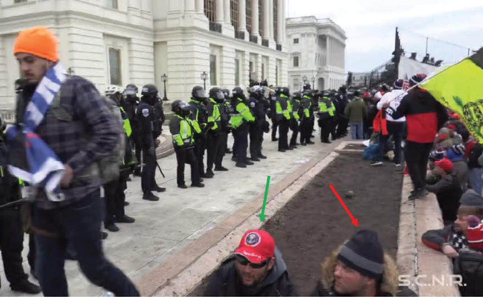 These photos from a federal court document allegedly show twin brothers Steven and Robert Hanna in the crowd of rioters at the U.S. Capitol building on Jan. 6, 2021.