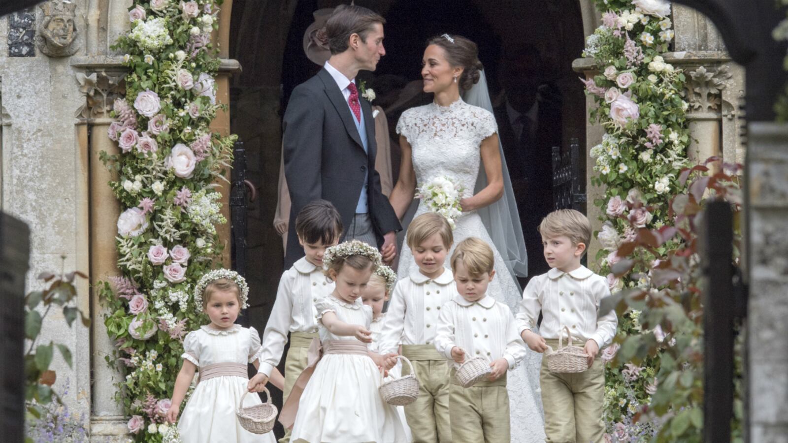 Pippa Middleton and James Matthews leave St Mark's Church following their wedding on May 20, 2017 in Englefield, England. Pippa Middleton, background right, and James Matthews leave St. Mark's Church after their wedding Saturday, May 20, 2017, in Englefield, England. Middleton, the sister of Kate, Duchess of Cambridge married hedge fund manager Matthews in a ceremony where her niece and nephew, Prince George and Princess Charlotte, were in the wedding party, along with sister Kate and princes Harry and William.