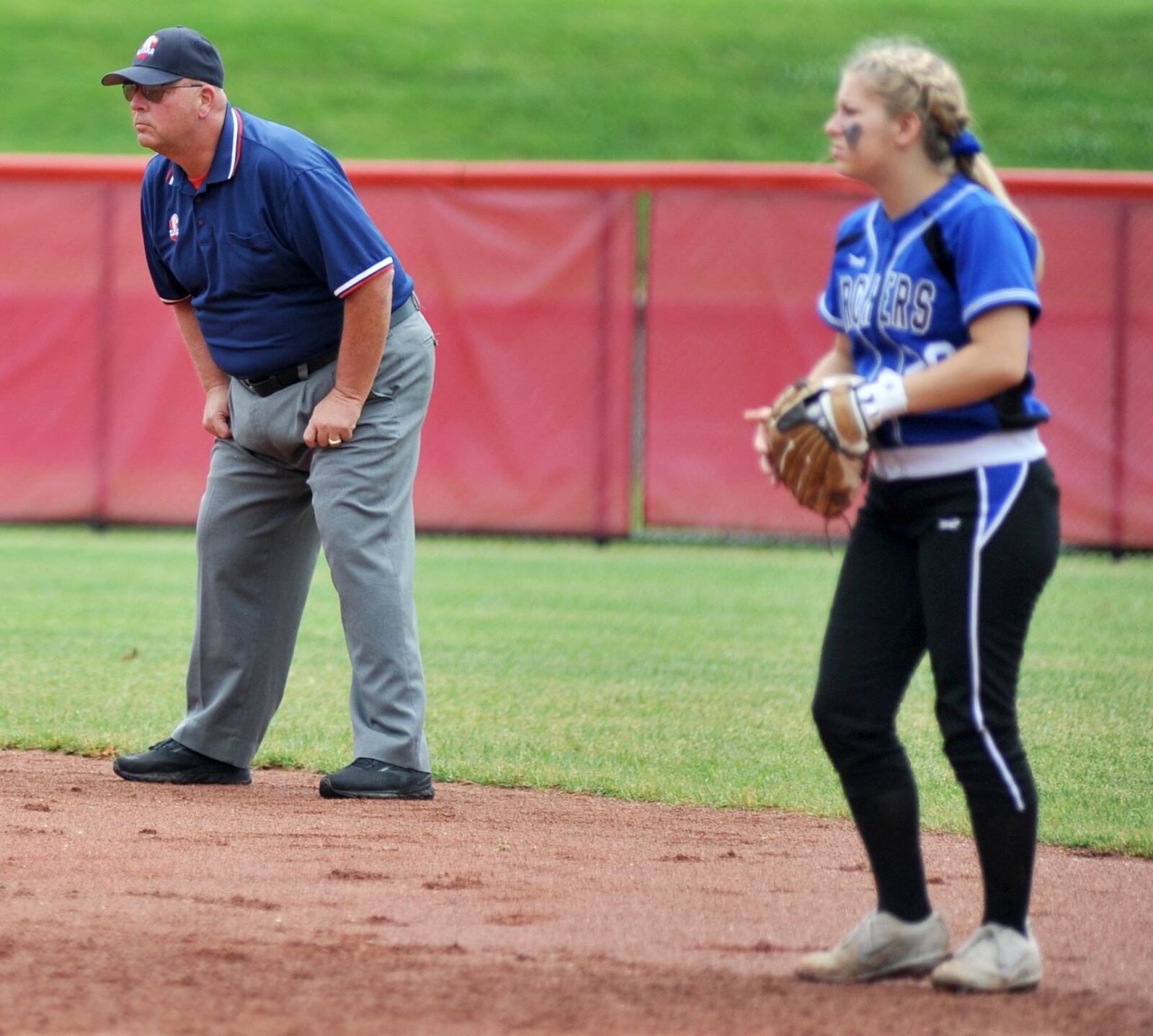 Umpire Gary Brockman and Antwerp second baseman Alyvia DeVore prepare for a pitch Sunday during the Archers’ 5-0 victory over Mechanicsburg in the Division IV state championship softball game at Firestone Stadium in Akron. RICK CASSANO/STAFF