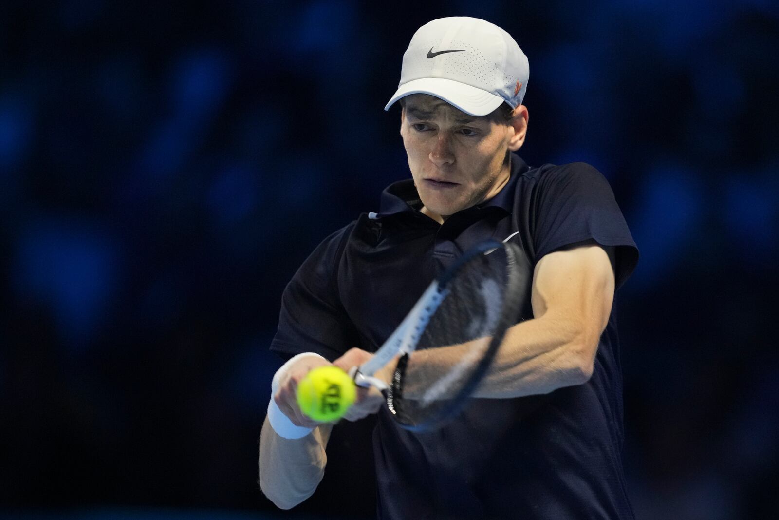 Italy's Jannik Sinner returns to Norway's Casper Ruud during their semifinal tennis match of the ATP World Tour Finals at the Inalpi Arena in Turin, Italy, Saturday, Nov. 16, 2024. (AP Photo/Antonio Calanni)