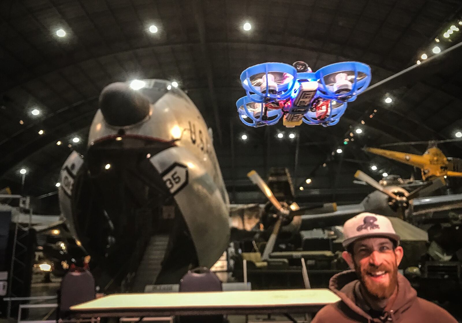 Micro-drone race organizer, Kele Stanley flies a drone for the media to promote their Saturday drone race at the USAF Museum.