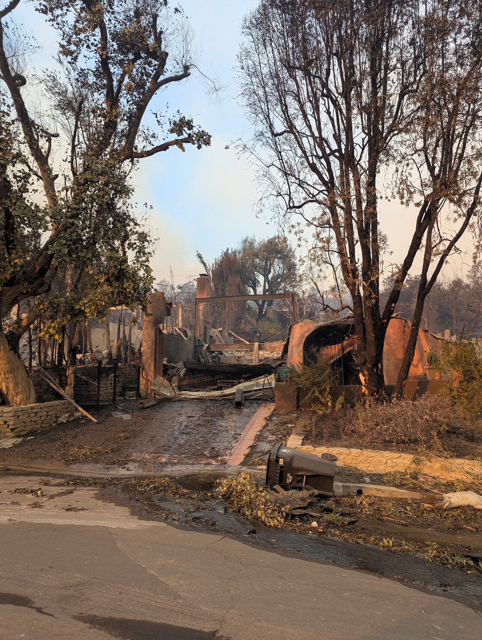 This image provided by Carolyn Kiefer shows her mother Katherine Kiefer's home destroyed by the Palisades Fire on Wednesday, Jan. 8, 2025, in Los Angeles. (Carolyn Kiefer via AP)