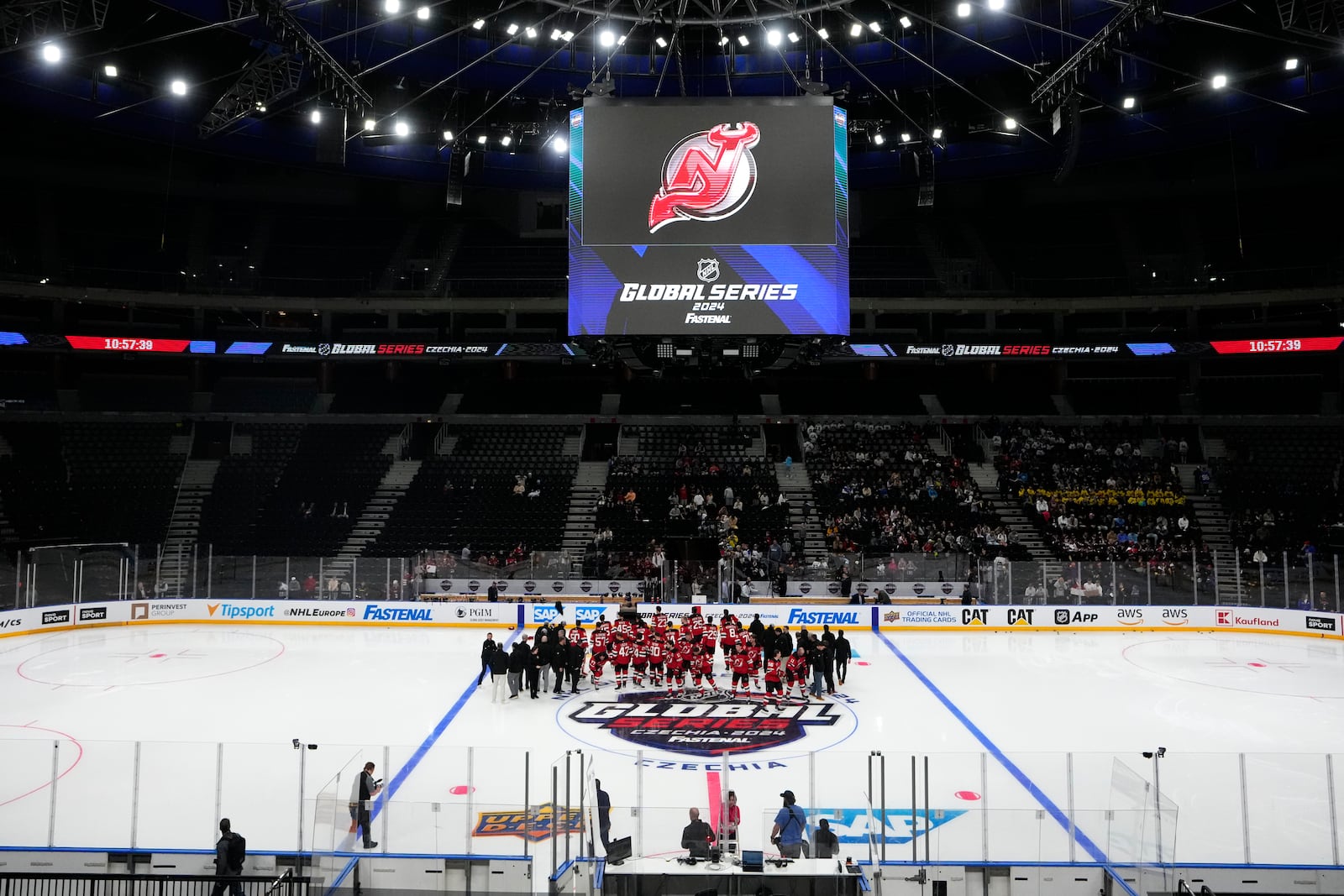 New Jersey Devils' players arrive for a practice session, a day before their NHL hockey game against Buffalo Sabres, in Prague, Czech Republic, Thursday, Oct. 3, 2024. (AP Photo/Petr David Josek)