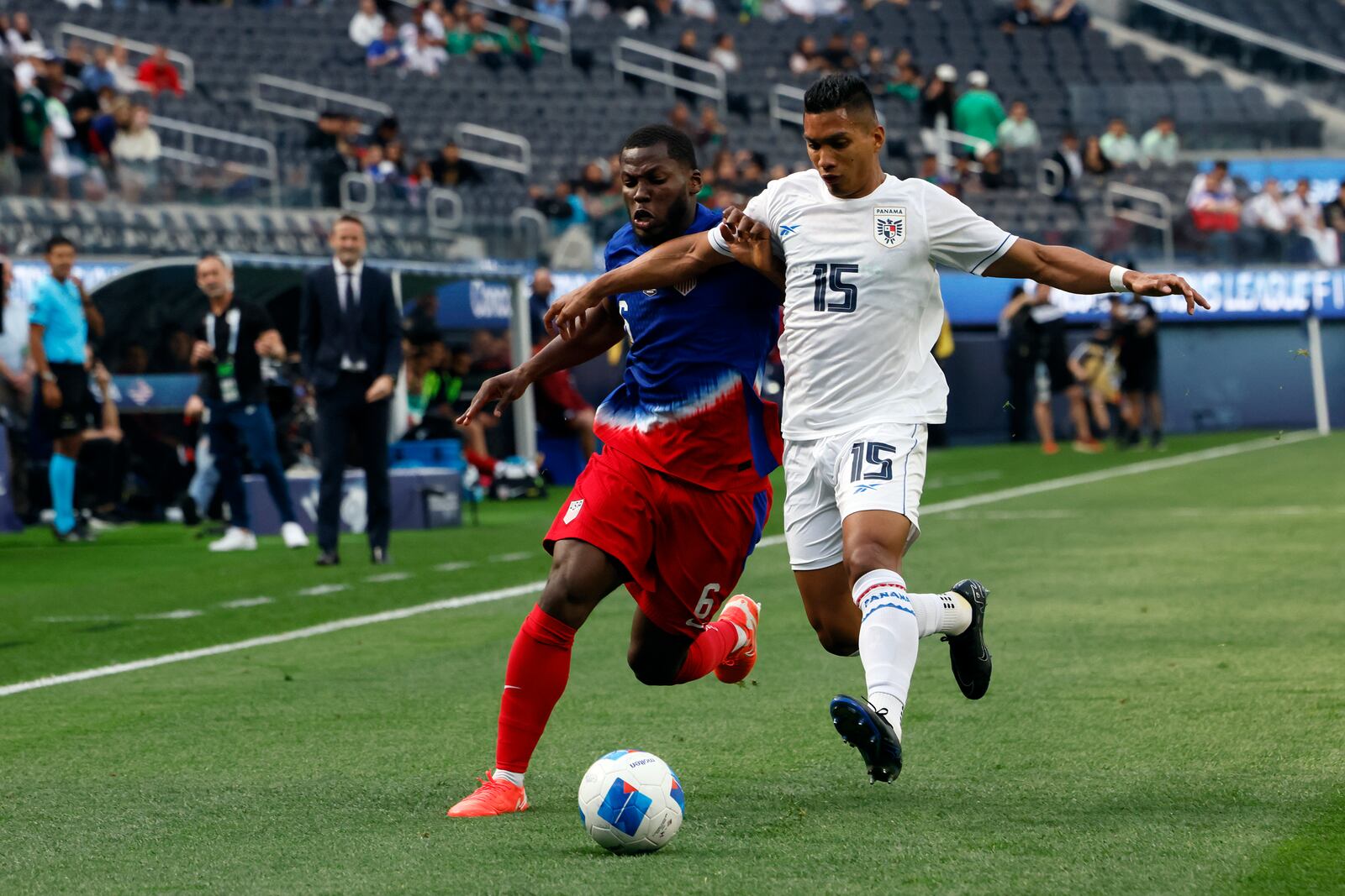 United States' Yunus Musah, left, vies for the ball against Panama's Jorge Gutierrez Cornejo (15) during the first half of a CONCACAF Nations League semifinal soccer match Thursday, March 20, 2025, in Inglewood, Calif. (AP Photo/Etienne Laurent)