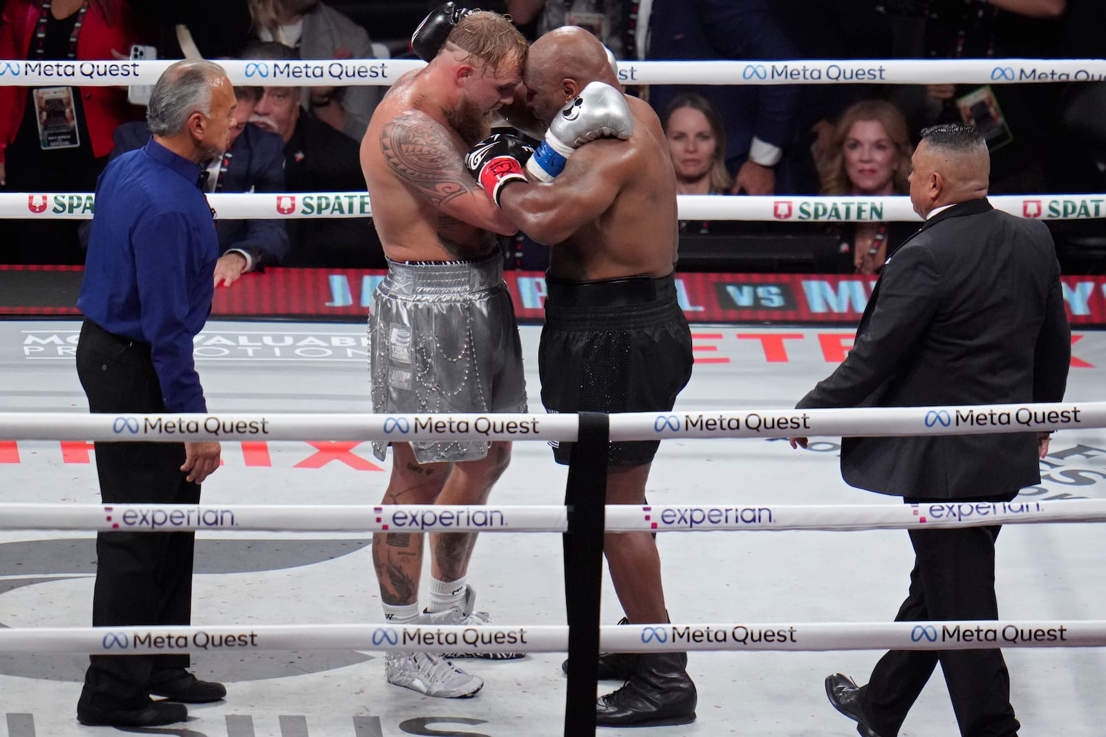 Jake Paul, left, and Mike Tyson embrace after their heavyweight boxing match, Friday, Nov. 15, 2024, in Arlington, Texas. (AP Photo/Julio Cortez)