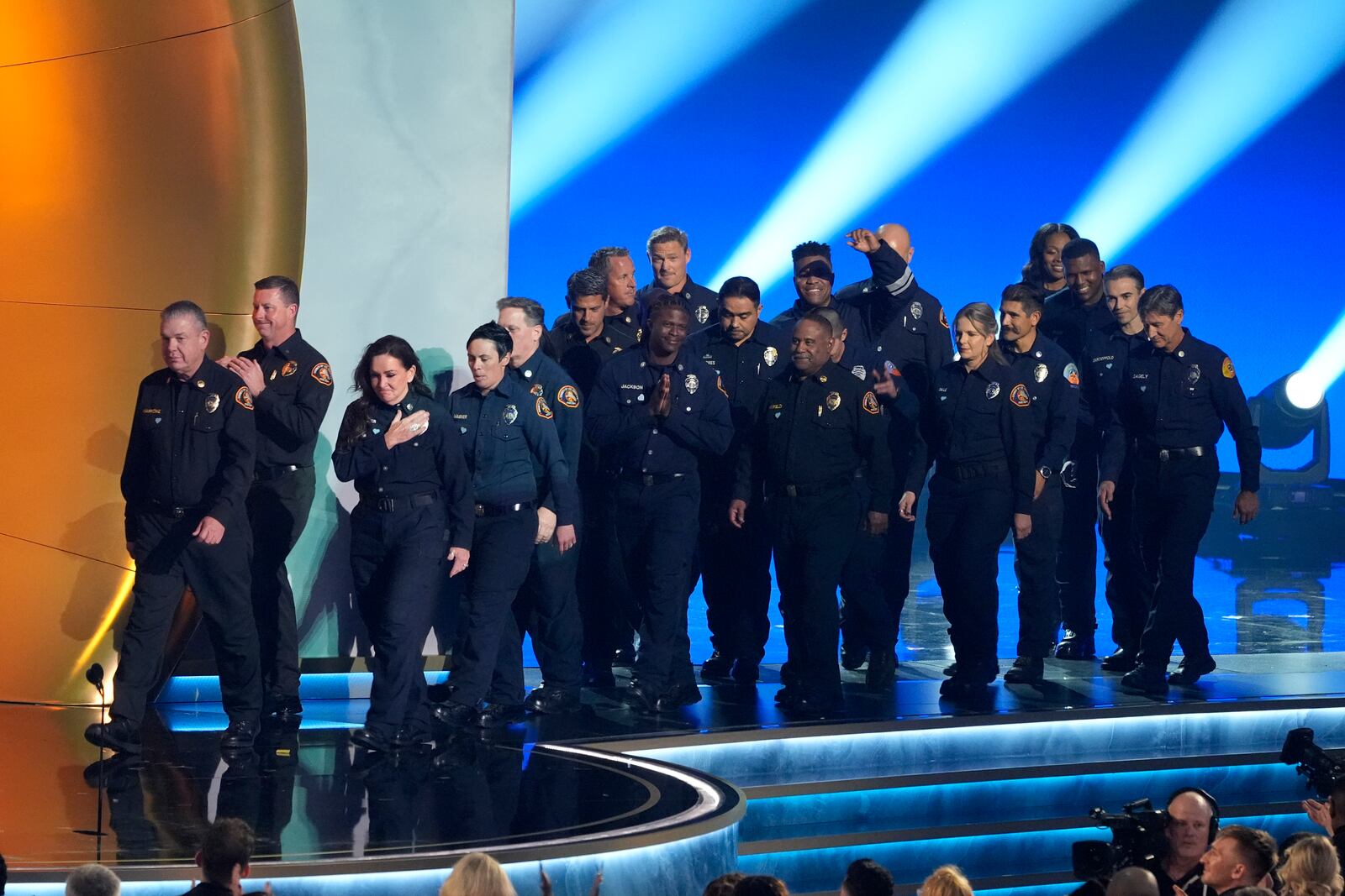 Members of the County of Los Angeles Fire Department present the award for album of the year during the 67th annual Grammy Awards on Sunday, Feb. 2, 2025, in Los Angeles. (AP Photo/Chris Pizzello)