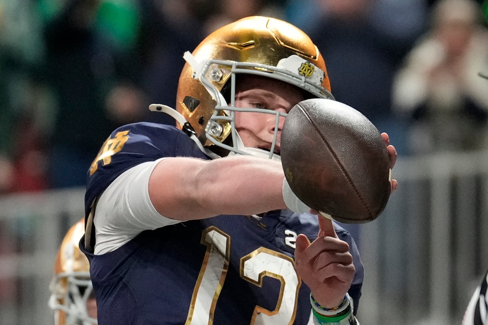 Notre Dame quarterback Riley Leonard celebrates after a touchdown against Ohio State during first half of the College Football Playoff national championship game Monday, Jan. 20, 2025, in Atlanta. (AP Photo/Brynn Anderson)