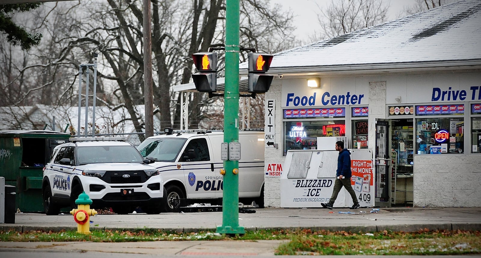 Springfield police on the scene of an officer-involved shooting at a  Sunoco station at the intersection of Selma Road and East Street Sunday morning. MARSHALL GORBY \STAFF