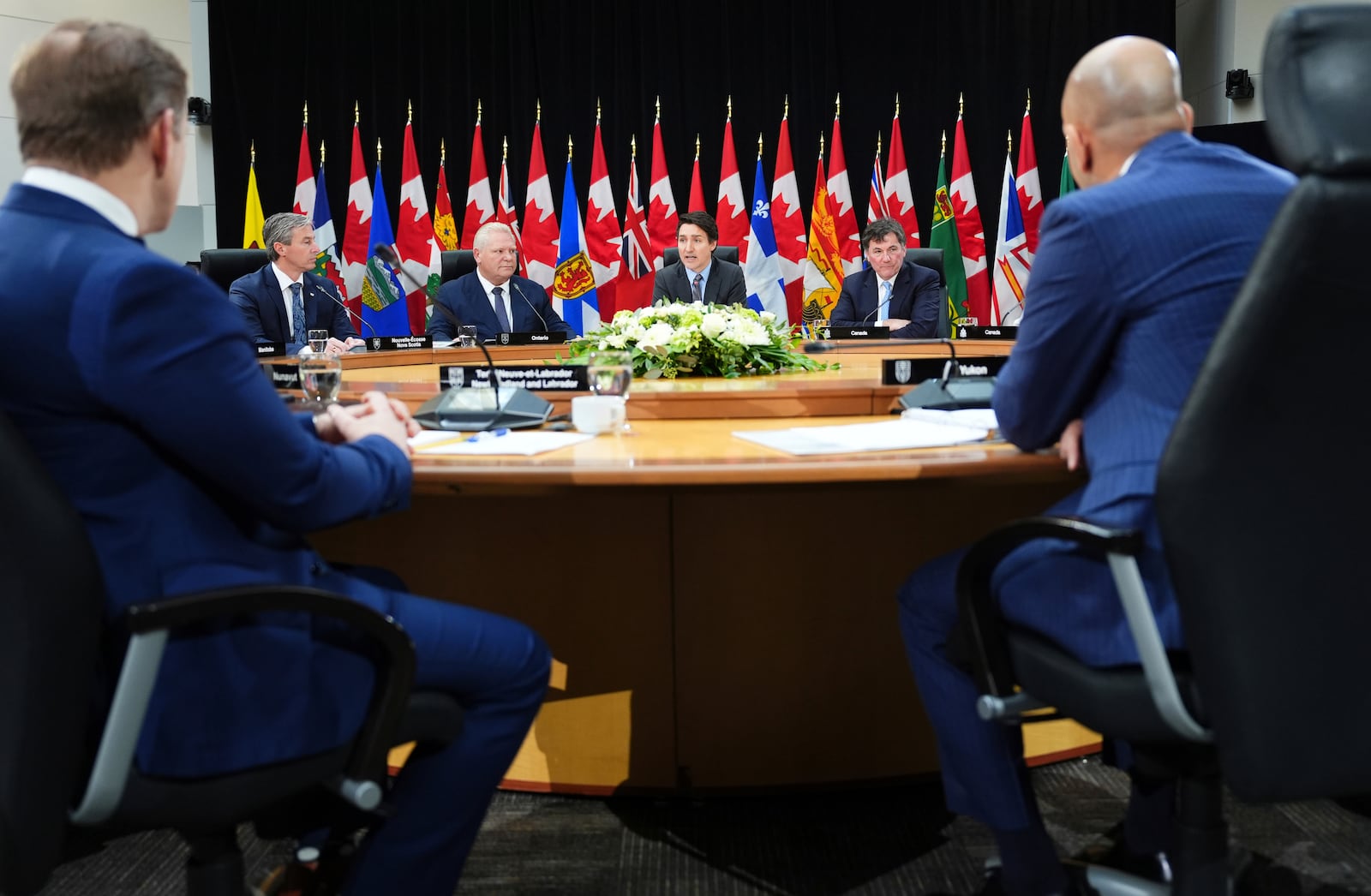 Canada Prime Minister Justin Trudeau, back center, and premiers attend the first ministers meeting in Ottawa on Wednesday, Jan. 15, 2025. (Sean Kilpatrick/The Canadian Press via AP)