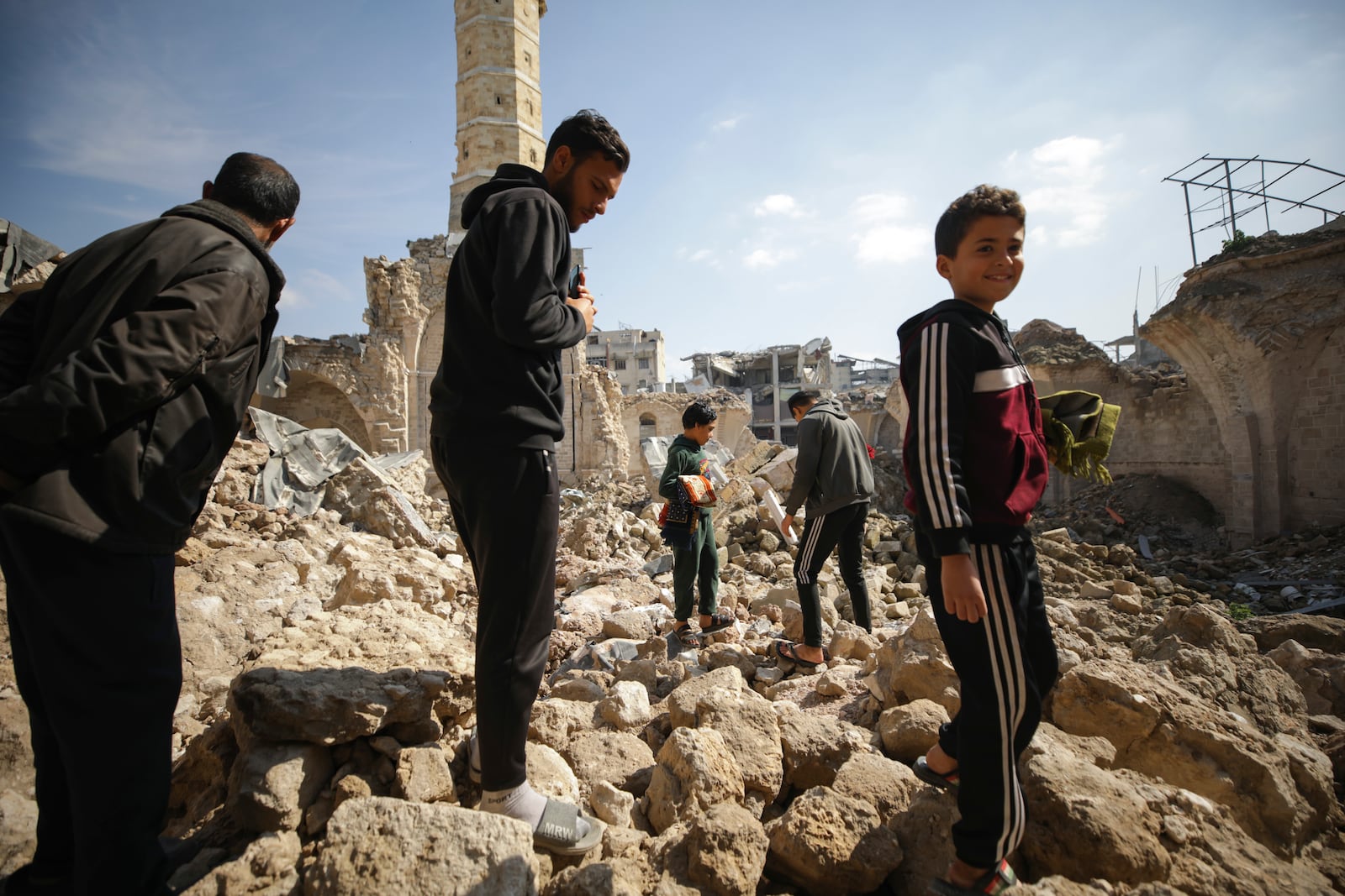 Palestinians gather to attend the Friday prayers at the Great Omari Mosque, which was damaged during the Israeli military's air and ground operation in Gaza City, Friday, Feb. 14, 2025. (AP Photo/Jehad Alshrafi)