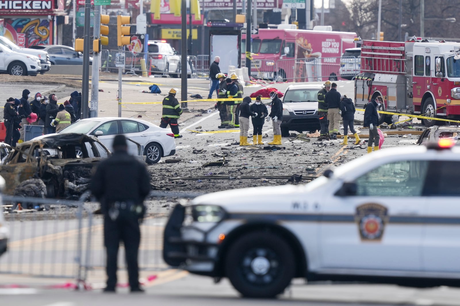 Investigators work the scene after a small plane crashed in Philadelphia, Saturday, Feb. 1, 2025. (AP Photo/Matt Rourke)