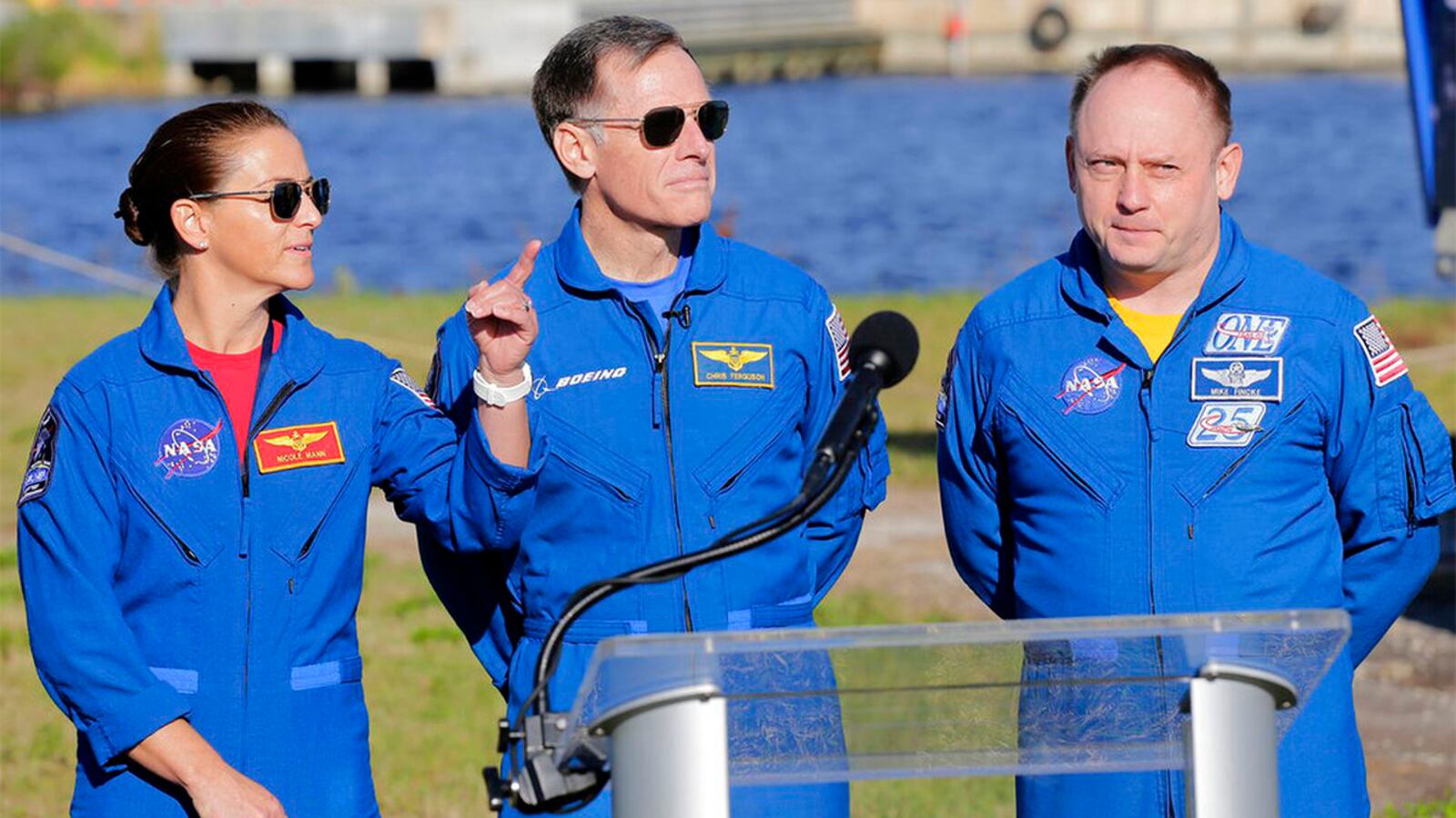 NASA astronaut Nicole Mann, left, gestures as Boeing astronaut Chris Ferguson, center, and NASA astronaut Mike Fincke look on during a press conference at the Kennedy Space Center, in Cape Canaveral, Fla., Thursday, Dec. 19, 2019. They will be the first crew to fly on the Starliner spacecraft some time next year.